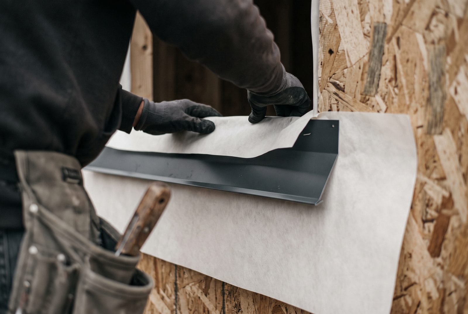 House wrap and flashing at a window opening.